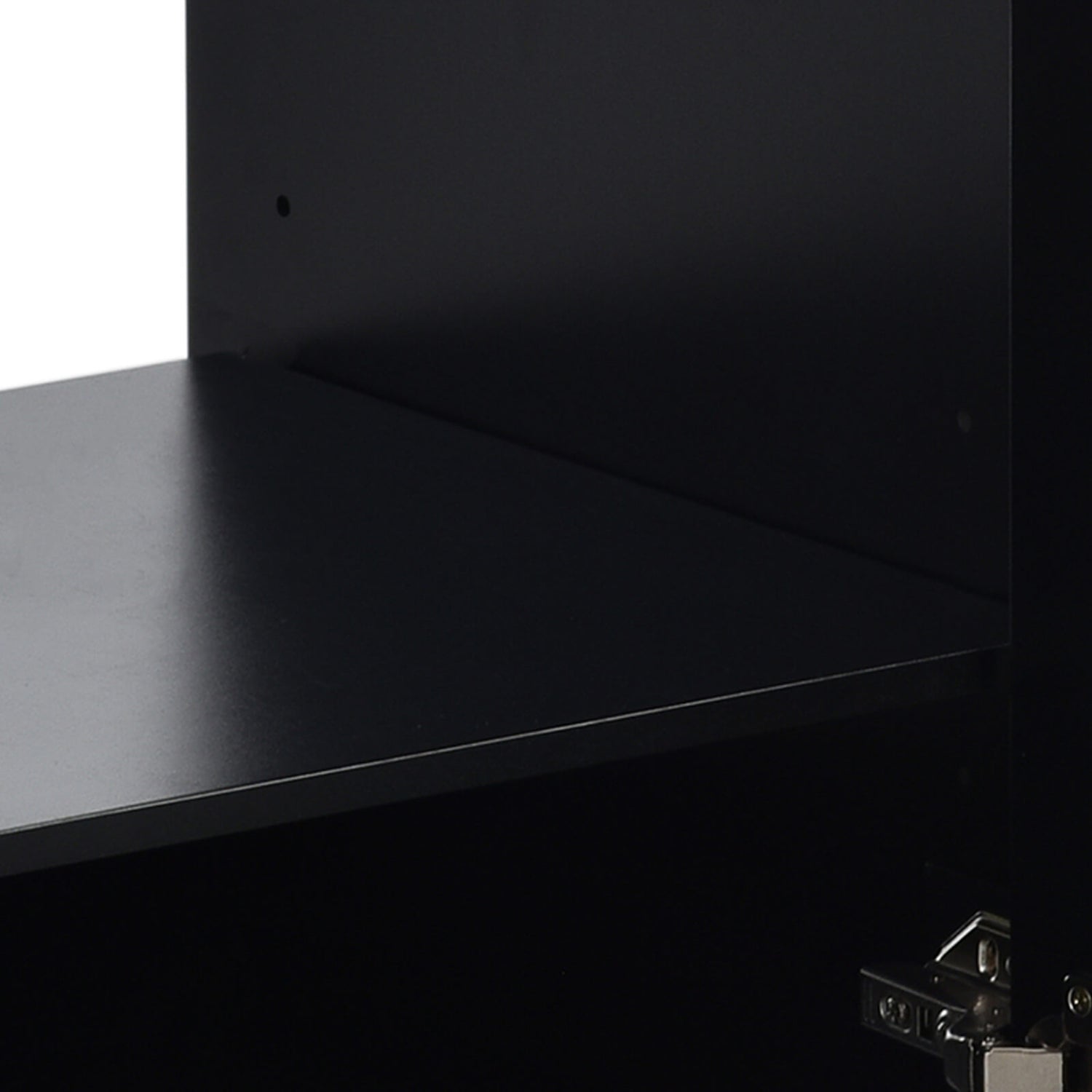 Adjustable shelves inside the black vanity cabinet for customized storage