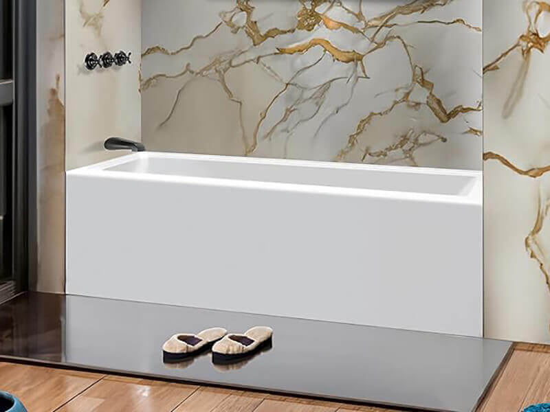 Alcove-style drop-in fiberglass bathtub with integrated apron