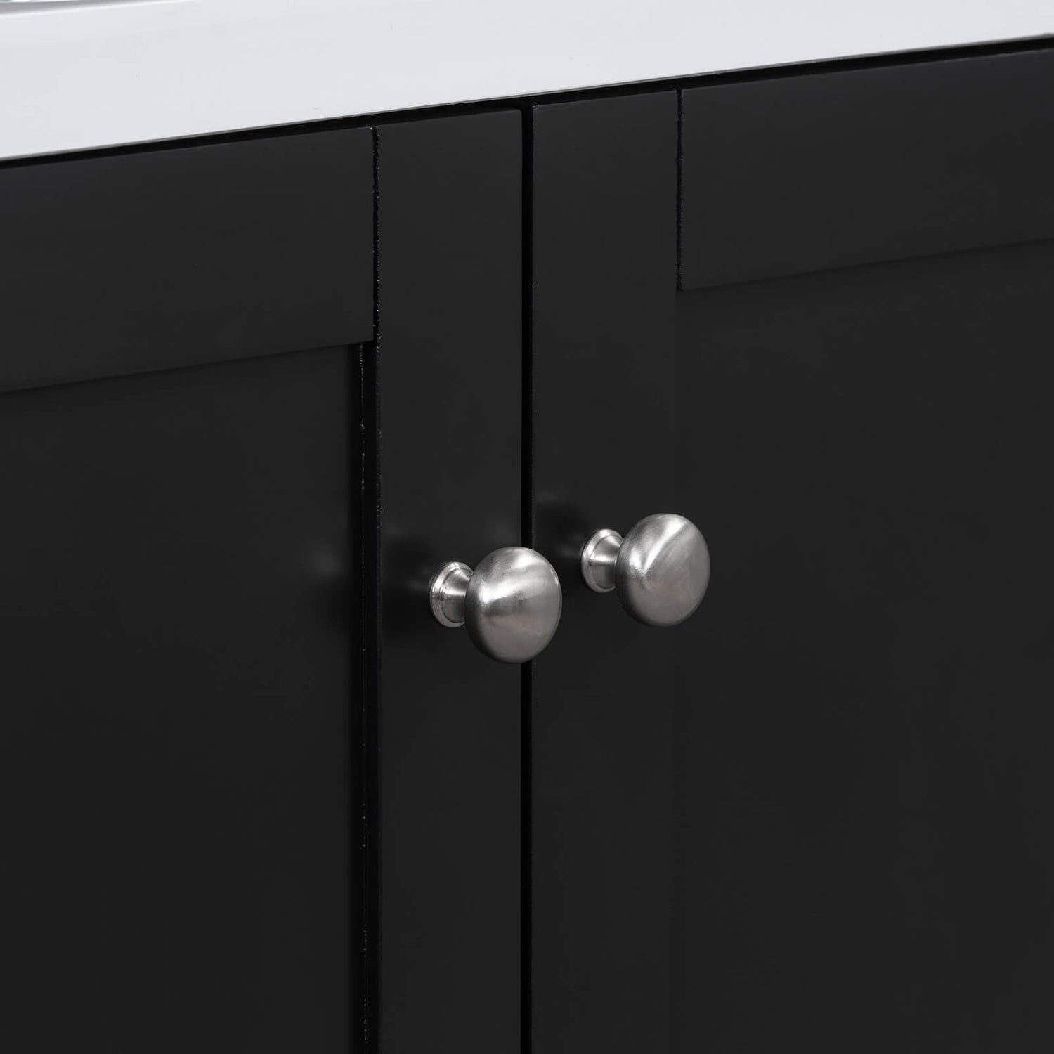 Detail of handles on a 36 inch black bathroom vanity with integrated USB charging