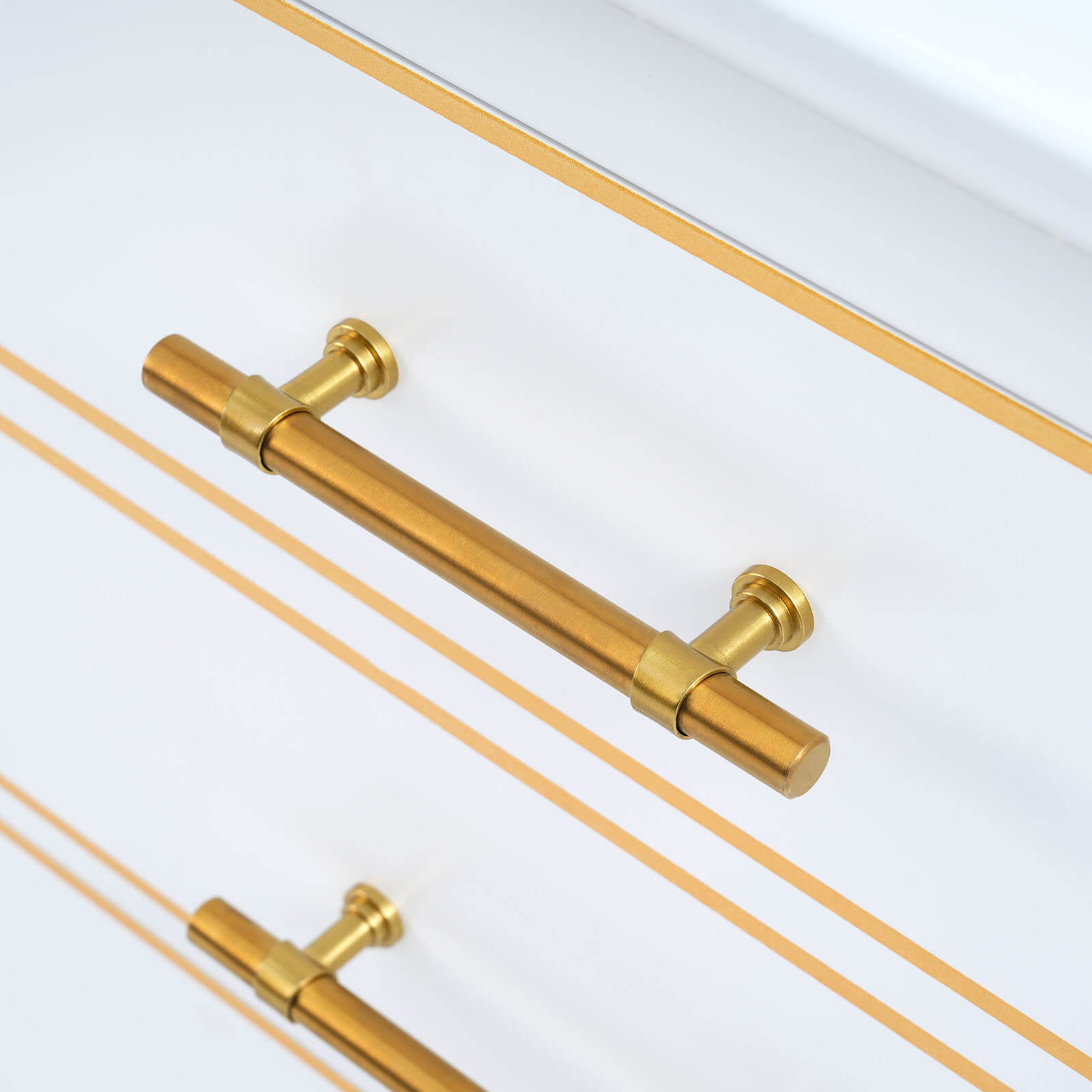 Detailed shot of the gold-accented drawer handles on the vanity