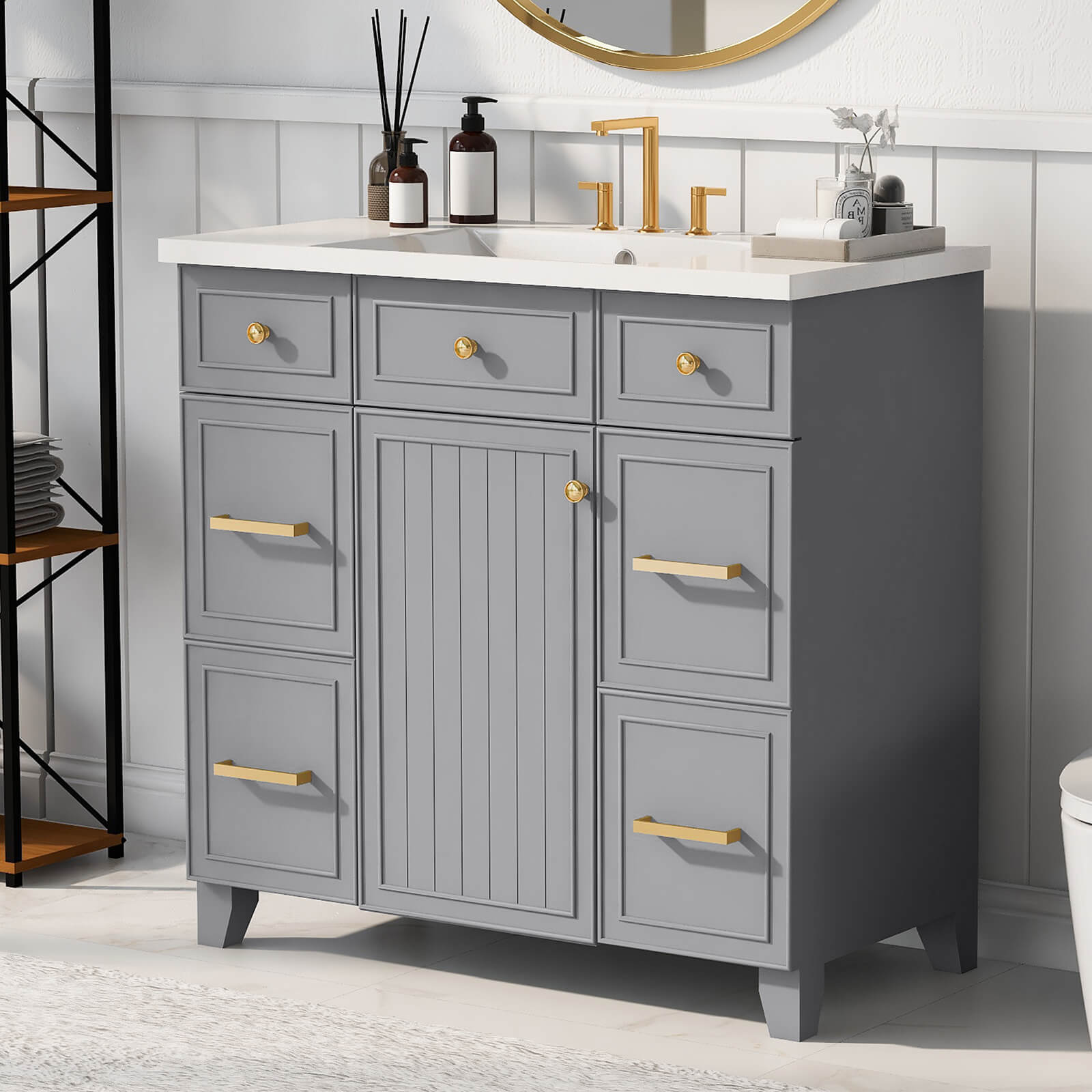 Grey bathroom vanity with ergonomic gold handles for easy use