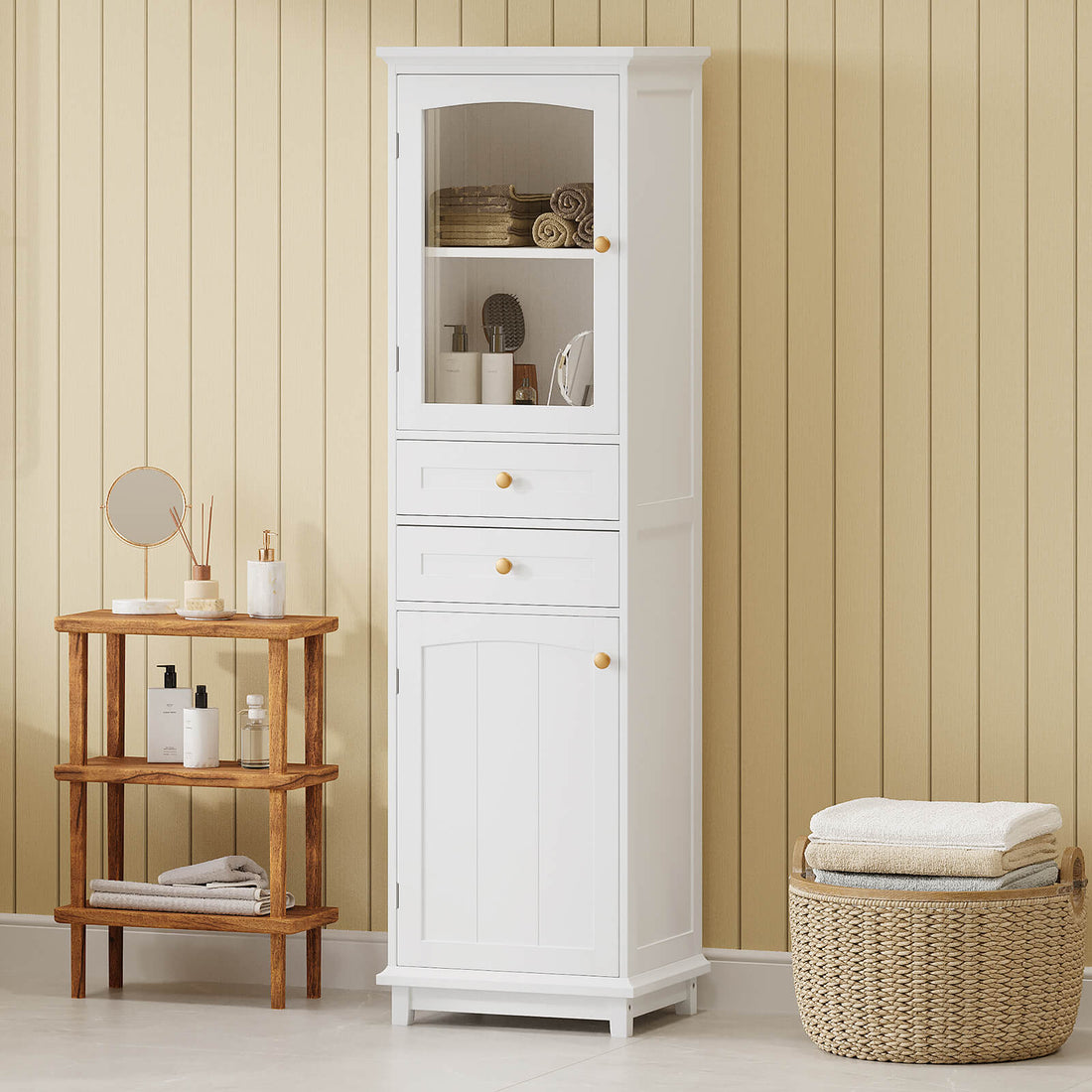 Tall white freestanding bathroom storage cabinet with gold handles and glass doors